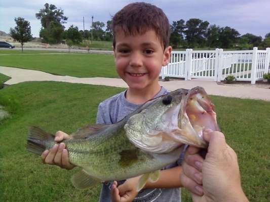 <p>
	 </p>
<p>
	This is Ethanâs first fish. Look at that proud smile!</p>
