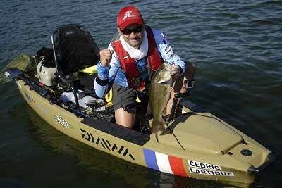 <p>GREAT BASS: Cedric Latigue proudly holds up a great bass he caught early on the final day of competition at the 2nd Hobie Fishing World Championship in Texas on Thursday.</p>
