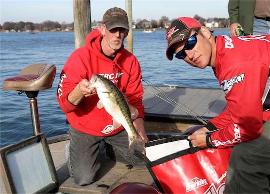 <p>The anglers return to Blythe Landing to weigh-in. Rick Dunstan holds the bag while partner Cliff Kirby adds a Lake Norman bass.</p>
