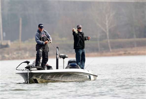 <p>Freeze abandons the net for his rod as Hite waves his small catch for the camera.</p>

