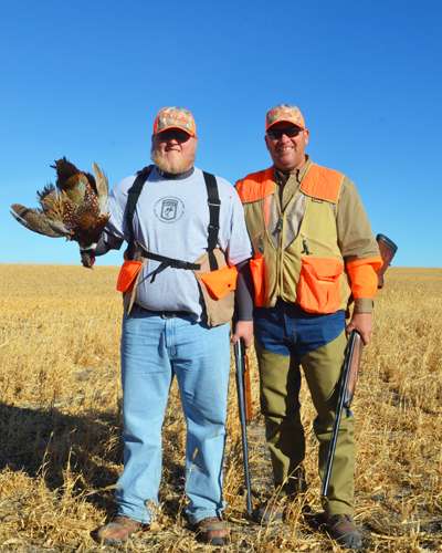 <p>Brett Stewart, Jon's son, shows off his first pheasant.</p>
