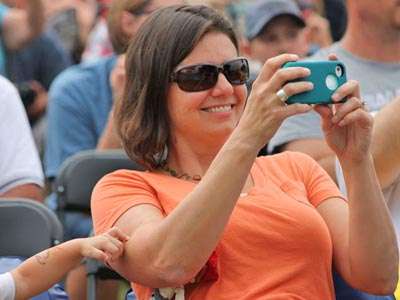 <p>Family: Julia Kennedy taking photo of her hubby on stage.</p>
