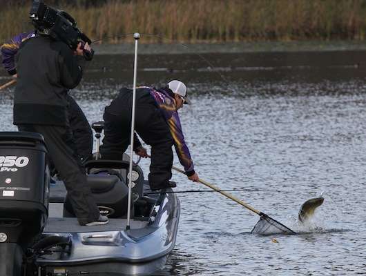 <p>Roberts stretches to put Bethelâs second big fish of the morning in the boat. </p>
