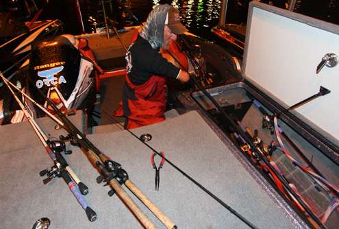 <p>Clay Dyer pulls his rods from the rod locker in preparation for Day One. </p>
