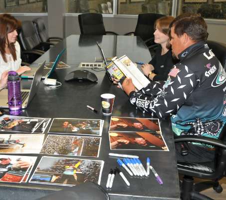<p>Lane gets a sneek peak at the 2013 Bassmaster Program & Media Guide, which will be available for sale at the Classic.</p>
