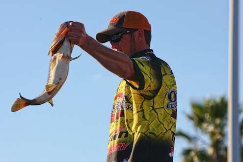 <p>Derek Remitz shows the crowd his best fish of the day. </p>
