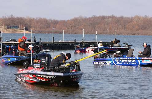 <p>Mike Iaconelli, Brandon Palaniuk and Alton Jones take a few moments to work on their tackle before loading their boats.</p>
