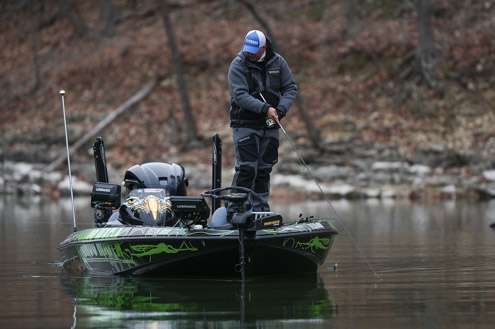 Jeremy Starks looks at his sonar as his moves along the bank.