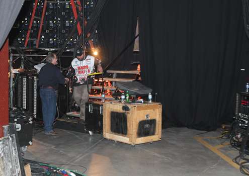 <p>Greg Hackney comes off the stage behind the scenes on Friday.</p>
