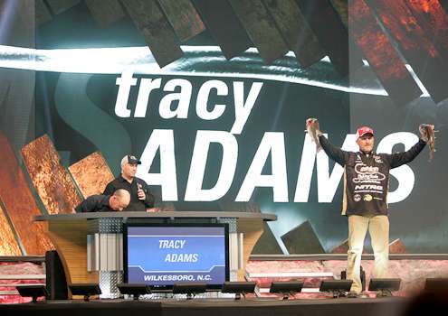 Tracy Adams gets cheers from the crowds as he holds up two good Grand Lake bass.