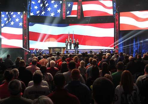 <p>Red, white and blue fills the stadium during the national anthem.</p>
