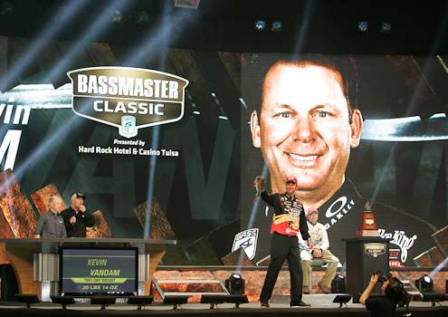 <p>Kevin VanDam holds up a fish as he weighs-in.<br />
	 </p>
