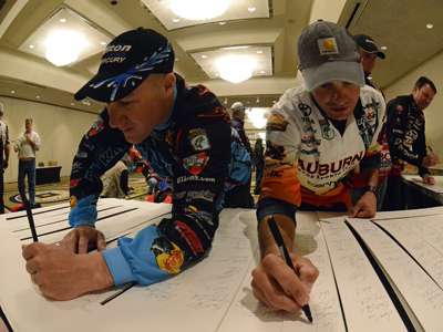 <p>"I'll sign next to the Angler of the Year," Lee says as he autographs photo frames next to Brent Chapman. "So far, this experience has been so great that I'm already planning on how to get back. I've got the Bass Pro Shops Bassmaster Central Opens next year along with another season of Carhartt College B.A.S.S. Series, and now that I'm here I know it'll change how I fish the Opens. Rather than fish for money and a good finish, I'm gunning to win."</p>
