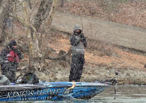 <p>Randy Howell lifts is second keeper of the day aboard amid snowfall. </p>
