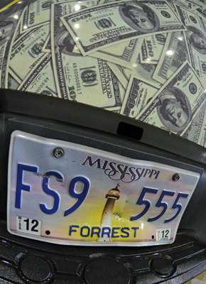<p>How many anglers do you know who have a crumpled-in tage like this? Probably more than a few. Most of Cliff Pace's Toyota is wrapped in $100 bills. Hi-Seas fuorocarbon's motto is "When money's on the line." </p>
