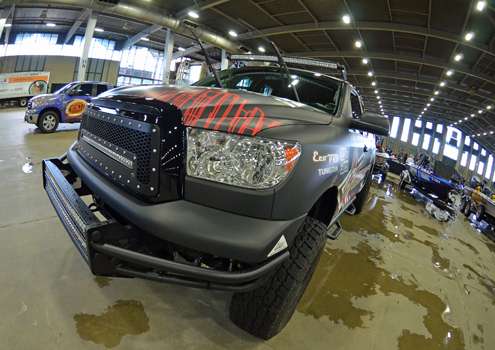<p>The front end of Palaniuk's Tundra is adorned with Rigid Industries lighting kits. When the kits are on, the whole undercarriage glows red. The truck also sports custom wheels and a lift kit.</p>
