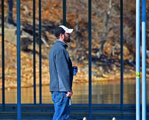 <p>A fan enjoys a frosty beverage on his dock as he watches Cherry fish.</p>
