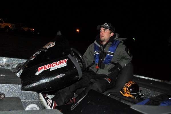 <p>Oklahoma State University's Caleb Masters helps B.A.S.S. employee Tony Quick check his boat.</p>
