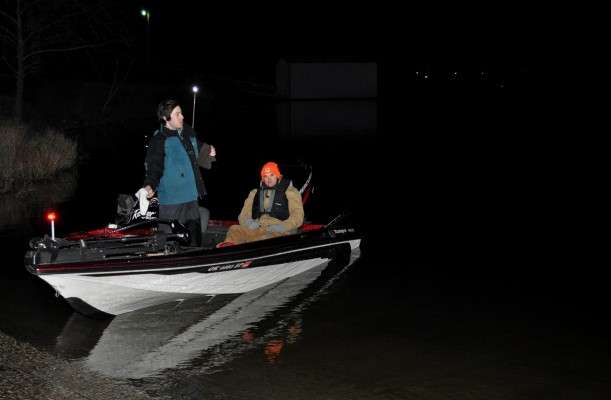 <p>Parks and Edminson check their boat and rods before setting off.</p>

