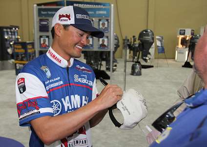 <p>Elite Series pro Chris Zaldain signs autographs in the Yamaha booth.</p>
