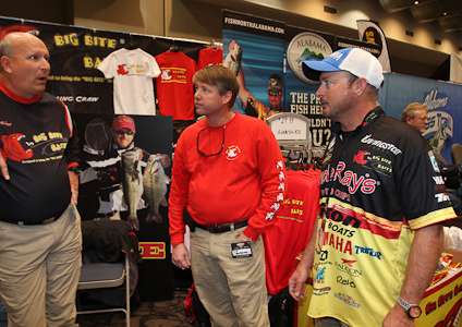 <p>Elite Series pro Jeff Kriet talks with the staff in the Big Bite Baits booth.</p>

