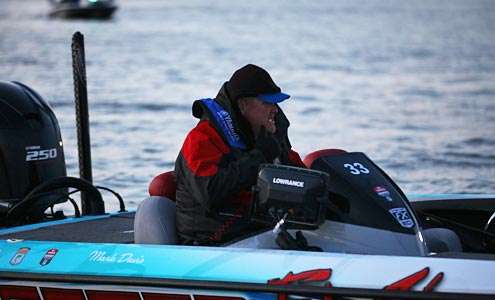 <p>Mark Davis idles around the docks as he awaits the 7 a.m. launch.</p>