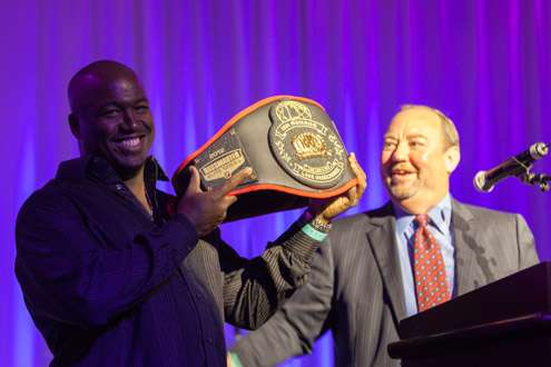 <p>Bruce Akin, CEO of B.A.S.S., presents Ish Monroe with the Century belt for his Okeechobee total of 108 pounds, 5 ounces.</p>
