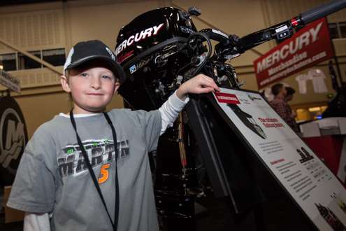 <p>Samual, age nine, also loves KVD. He is with his dad checking out the Mercury booth. Newton, Kan., is home.</p>
