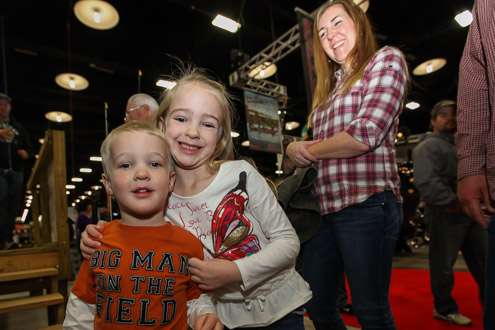 <p>Ava, age six, and her little brother TJ, age three, are in line to do some casting at the Academy Sports + Outdoors booth. Mom looks on enjoying the day. The family traveled from Broken Arrow, Okla.</p>
