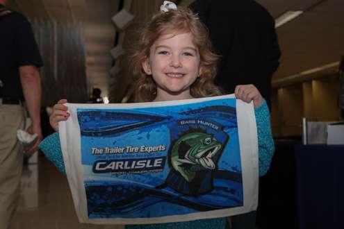 <p>The Bassmaster Classic Expo presented by Dick's Sporting Goods attracts lots of families -- and the kids love all the giveaways. Tate, age 4, from Rhome, Texas, is at her third Classic.</p>
