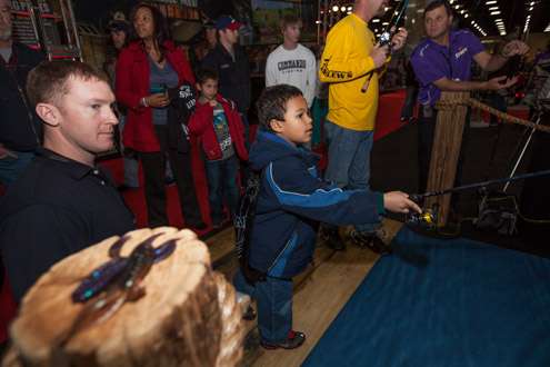 <p> </p>
<p>Zane, 7, makes a cast in the Pure Fishing booth.</p>
