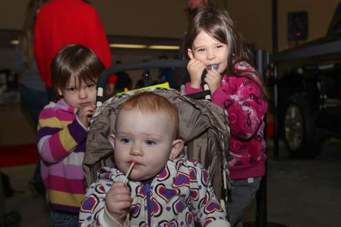 <p>Kristen, 2; Lindsey, 1; and Melissa, 4, are hometown Tulsa kids and love some lollipops while taking in the expo!</p>
