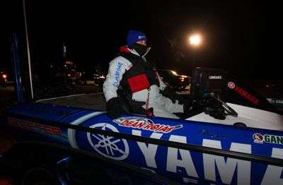 <p>Elite angler Dean Rojas rides his boat into the chilly waters of Grand Lake. </p>