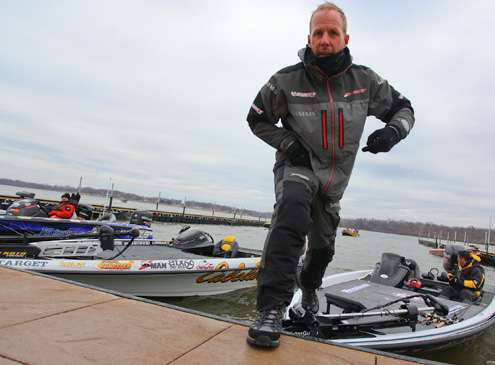 <p>Aaron Martens springs from his boat to run for his truck. </p>
