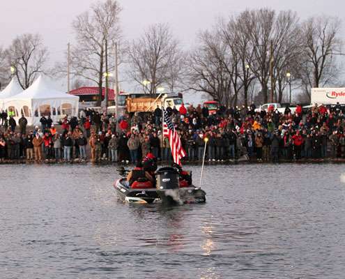 The national anthem is played at 6:57 a.m. and the first boat is launched promptly at 7 a.m.