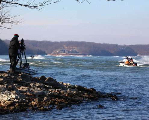 A cameraman gets a shot of Iaconelliâs flotilla from the bank.