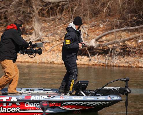 Iaconelli hooks up. The next 12 photos show a long catch process that sends him all the way around the boat.