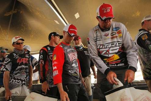 <p>#8 Anglers wait in line for their moment to weigh in.</p>
