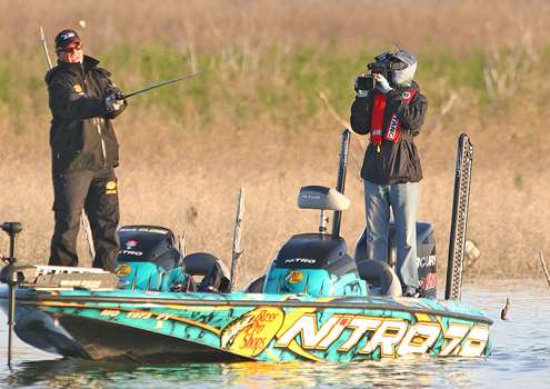 <p>Clunn works a shallow crankbait around the cover.</p>
