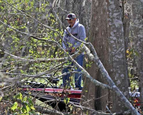 <p>Paul Elias appears to be fishing in the woods, but he's actually working his way up a small sliver of water.</p>
