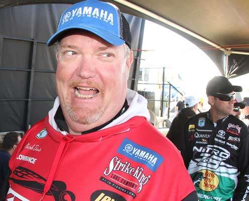 <p>Mark Davis, who finished the day in second, jokes with an outdoor writer prior to weighing in Thursday.</p>
