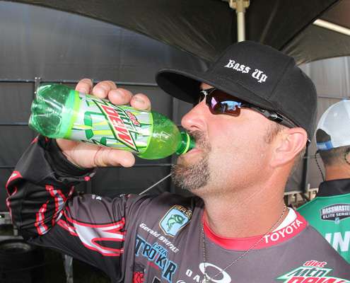 <p>Gerald Swindle chugs a Diet Mtn Dew behind the stage Saturday.</p>
