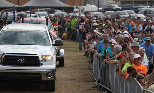 <p>Fans line a lane the anglers and their boats are pulled through to the weigh-in stand.</p>
