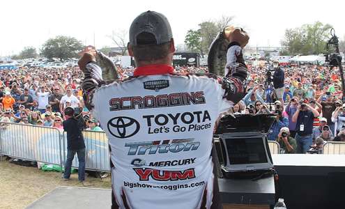 <p>Terry Scroggins shows the huge crowd his two best fish of the day.</p>
