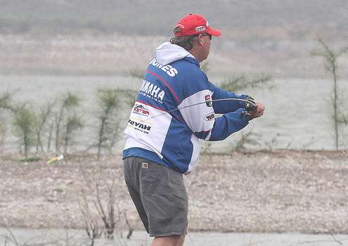 <p>Alton Jones works hard to cast his lures in the strong winds.</p>
