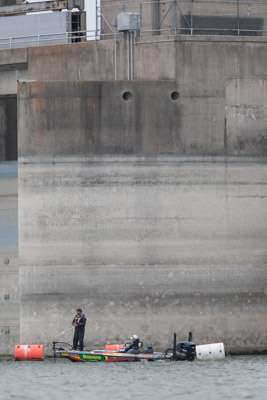 <p>Keith Poche works up close and personal at the big Falcon Lake dam.  </p>
