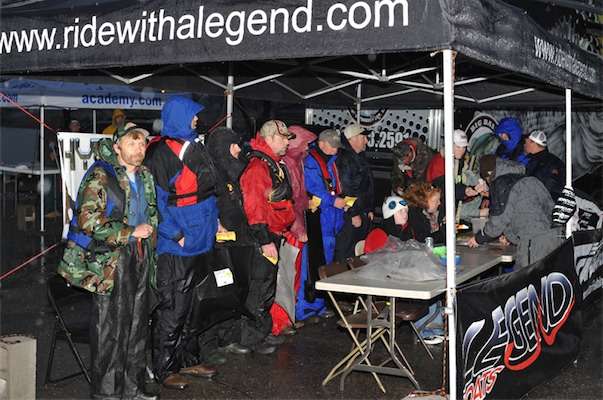 <p>Anglers wait in the rain to see if they are in the Top 10.</p>
