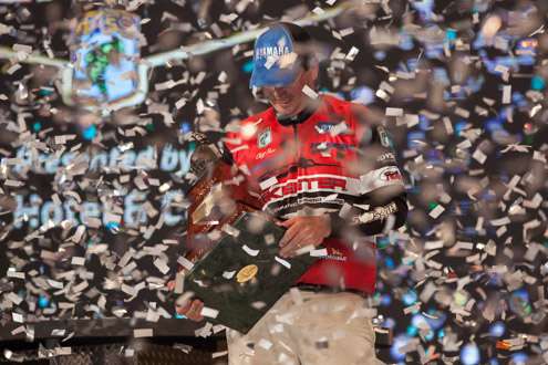 <p>The Champion takes a moment to admire the Classic Trophy. What a great way to end the 2013 Bassmaster Classic!</p>
