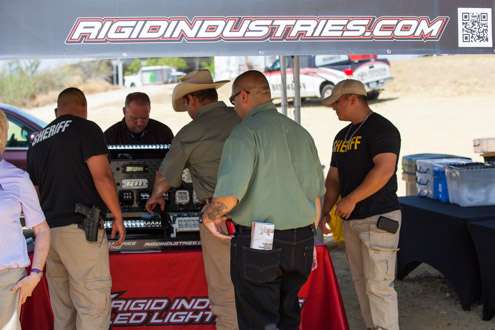 <p>The Zapata County Sheriff Alonso Lopez and his crew stop and take a look at the Rigid Industries booth before they get to work helping with the weigh in operation. It's great to have the support.</p>
