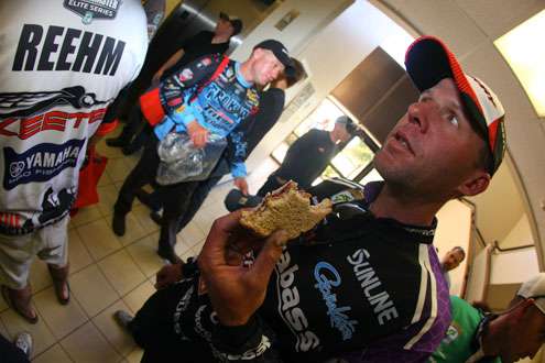 <p>Aaron Martens fuels up with a peanut butter and jelly sandwich on the eve of Day One on the Sabine River. </p>
